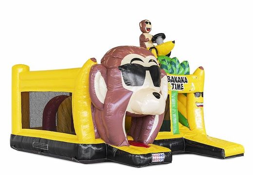 Ordene un castillo hinchable inflable con obstáculos y un tobogán con tema de mono banana